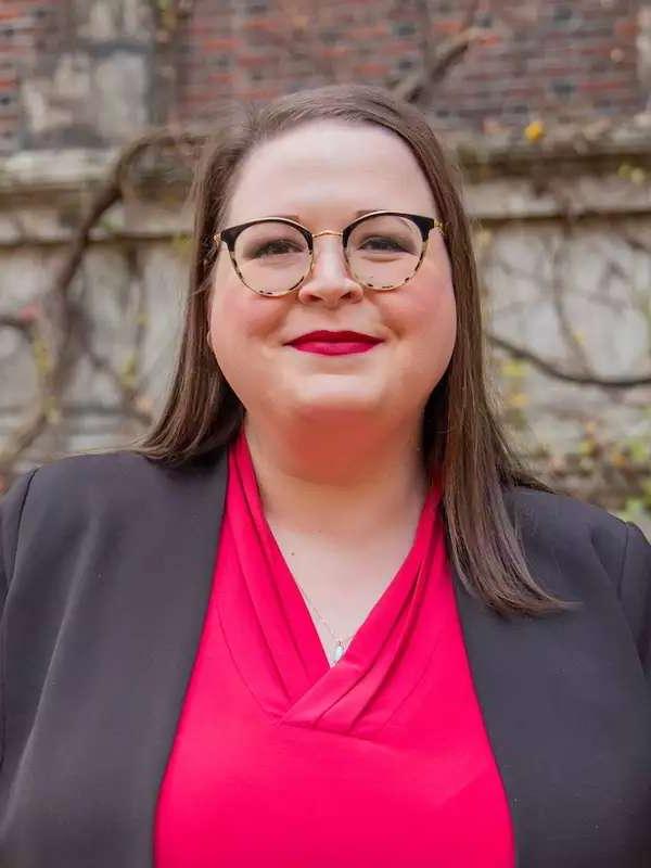 mixed background, woman smiling with red lips, pink top and gray blazer